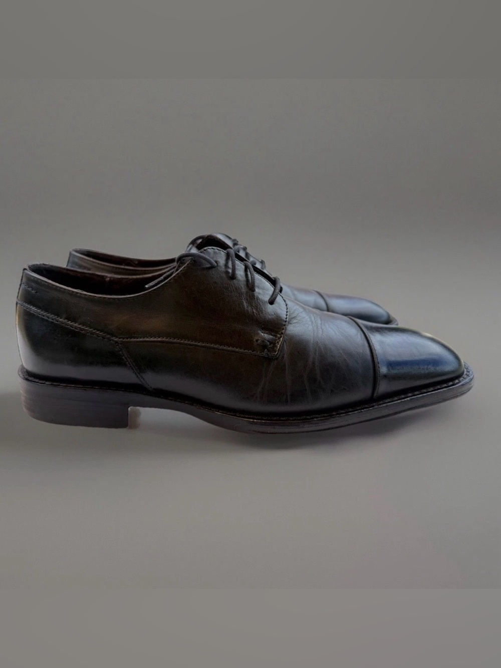 Johnston & Murphy Melton cap toe derby shoes.